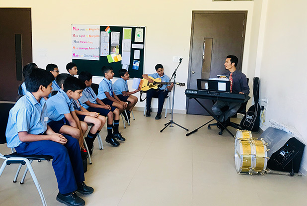 Students in a music class at Sri Sri Academy, part of Rausheena Group's community initiatives