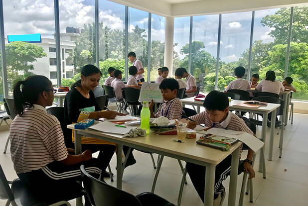 Students sharing a meal in the school dining area